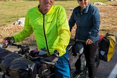 Randy Fay and wife Nancy on loaded tandem bicycle